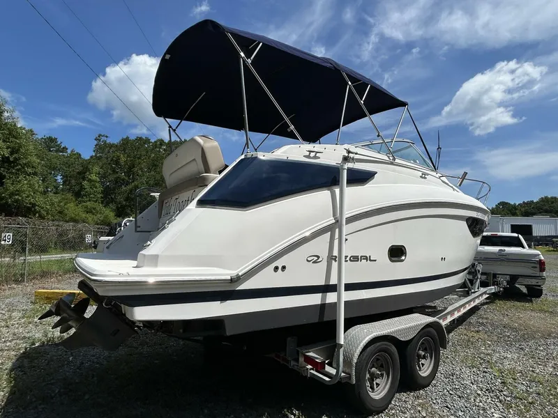 Slide: The Image of 2017 Regal 26 Express boat on trailer under blue sky. - 5