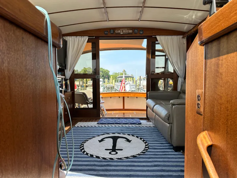 Slide: The Image of Interior of a 1977 Egg Harbor 33 Sedan boat with nautical decor and cozy seating. - 26