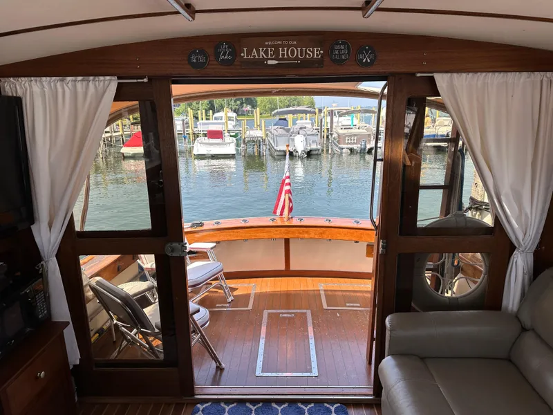Slide: The Image of Interior view of 1977 Egg Harbor 33 Sedan yacht with marina backdrop. - 27