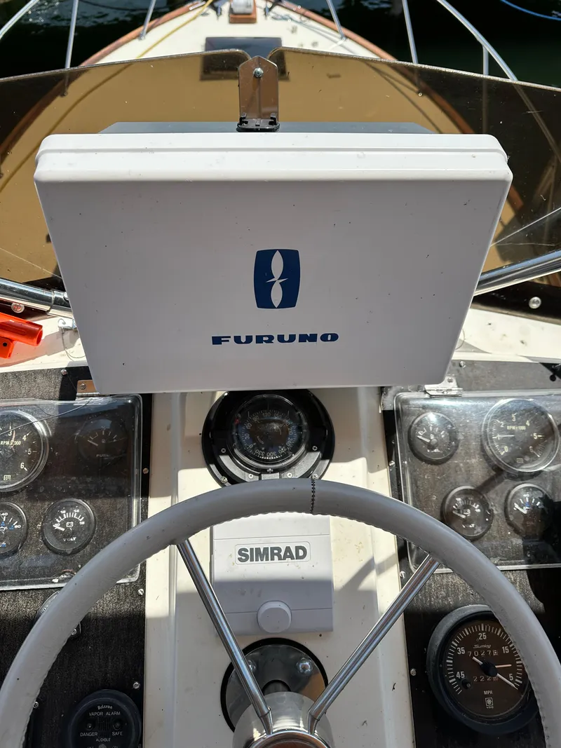Slide: The Image of 1977 Egg Harbor 33 Sedan helm with Furuno and Simrad navigation equipment. - 35