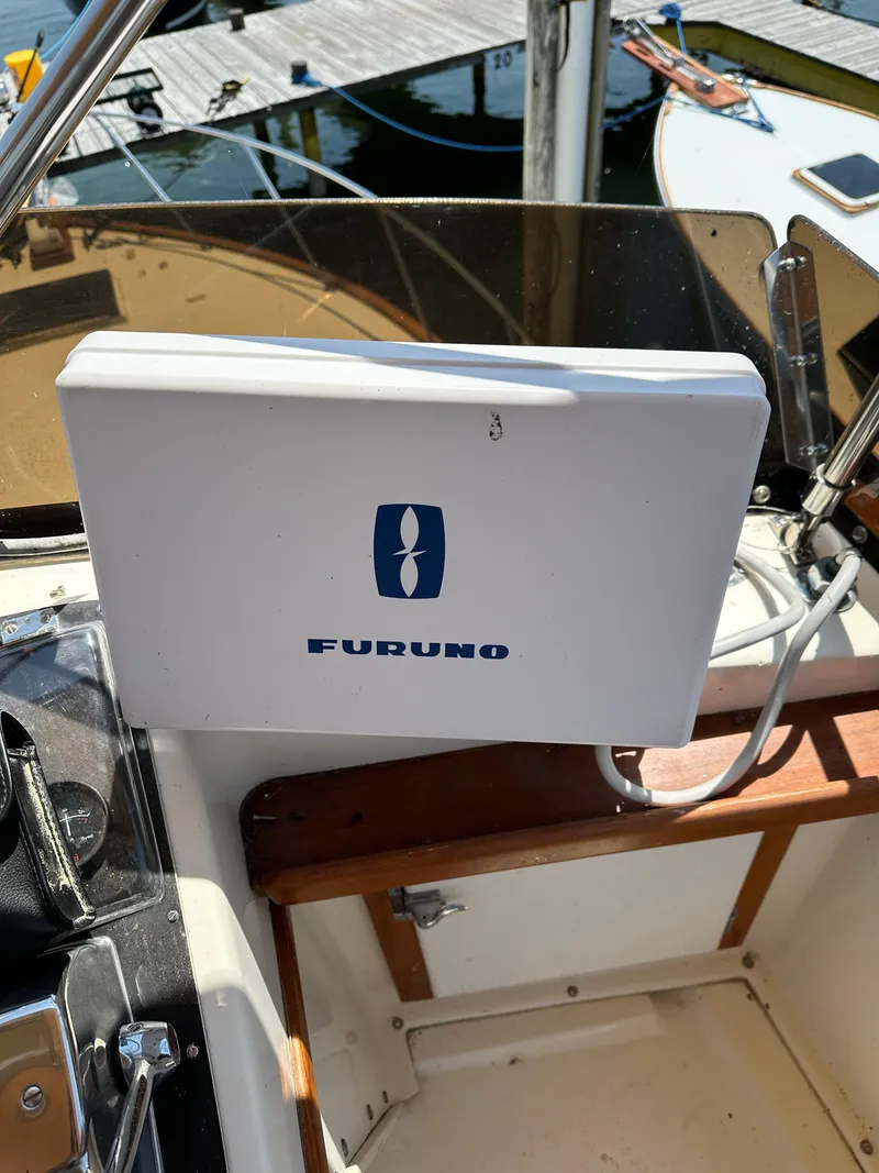 Slide: The Image of Furuno equipment on 1977 Egg Harbor 33 Sedan boat, docked at marina. - 36