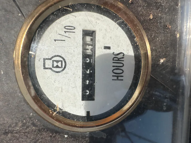 Slide: The Image of Hour meter on 1977 Egg Harbor 33 Sedan boat dashboard. - 38