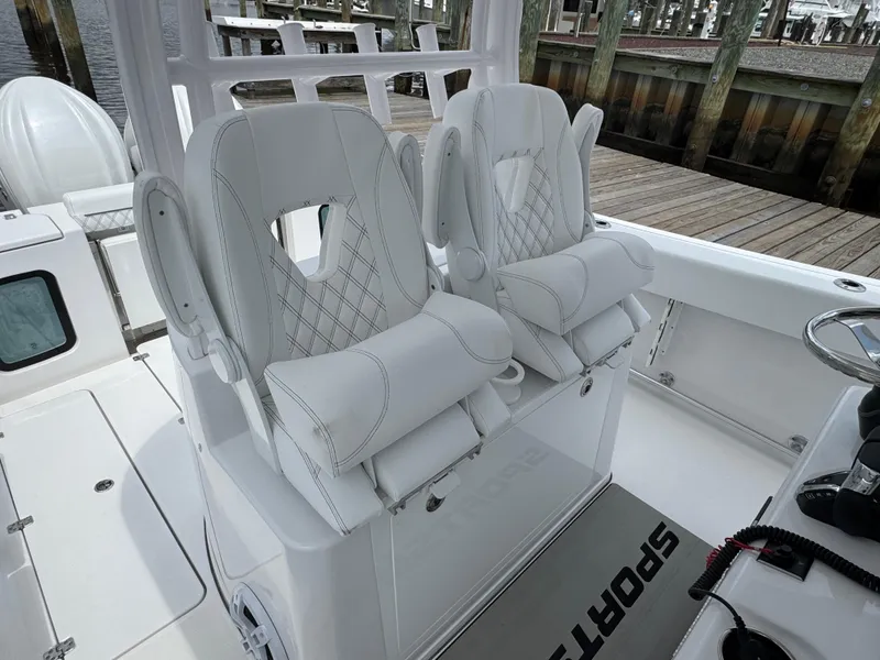 Slide: The Image of 2024 Sportsman Open 302 Center Console with luxurious white seating and modern design. - 6