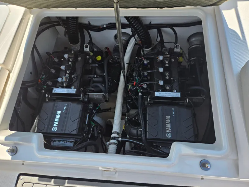 Slide: The Image of Engine compartment of a 2018 Yamaha Boats 210 FSH Sport, showcasing dual Yamaha TR-1 engines. - 21