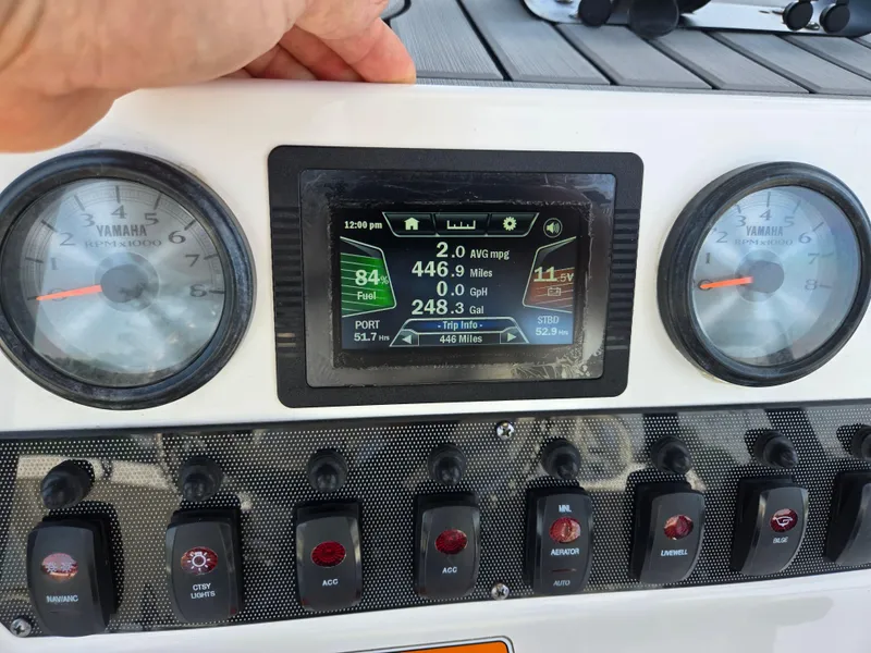 Slide: The Image of Dashboard of 2018 Yamaha Boats 210 FSH Sport with gauges and digital display. - 25