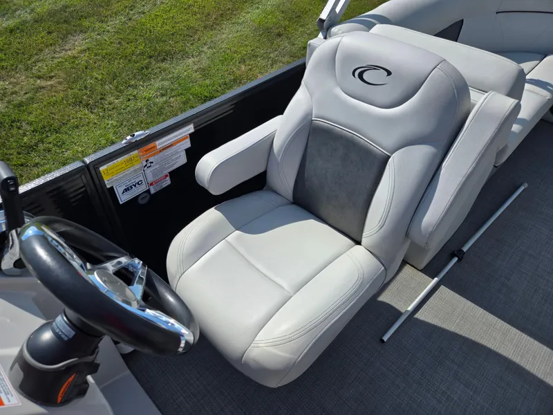 Slide: The Image of Captain's seat of 2021 Crest Classic LX 220 SLC boat, featuring plush upholstery. - 15