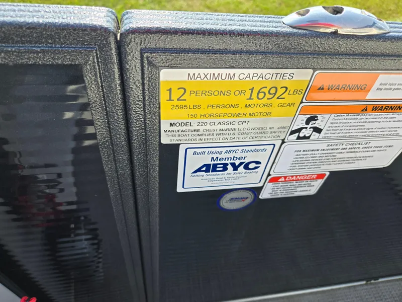 Slide: The Image of Capacity and safety labels on 2021 Crest Classic LX 220 SLC boat. - 16