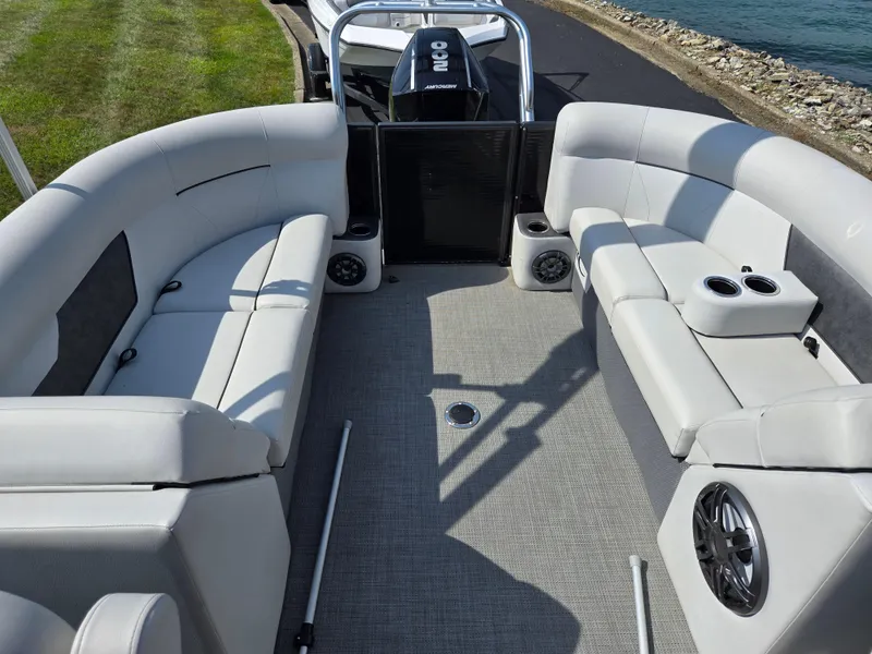 Slide: The Image of 2021 Crest Classic LX 220 SLC pontoon boat interior with plush seating and cup holders. - 17