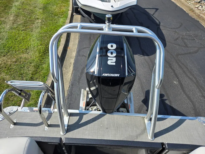 Slide: The Image of 2021 Crest Classic LX 220 SLC with Mercury 200 outboard engine, docked on pavement. - 18