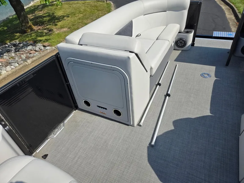 Slide: The Image of 2021 Crest Classic LX 220 SLC boat interior with gray seating and flooring. - 22