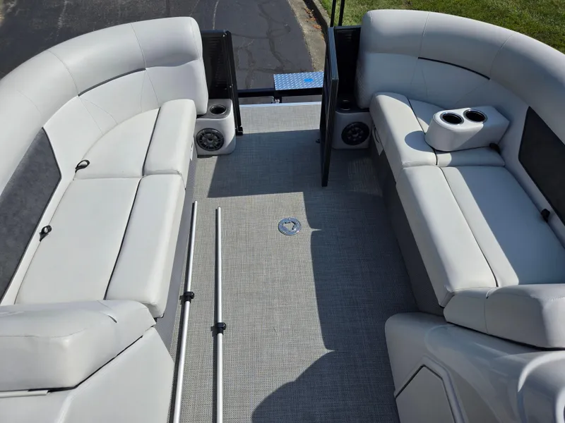 Slide: The Image of Interior of 2021 Crest Classic LX 220 SLC pontoon boat with gray seating and flooring. - 24
