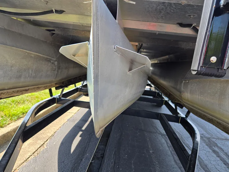 Slide: The Image of Underneath view of a 2021 Crest Classic LX 220 SLC pontoon boat on a trailer. - 7