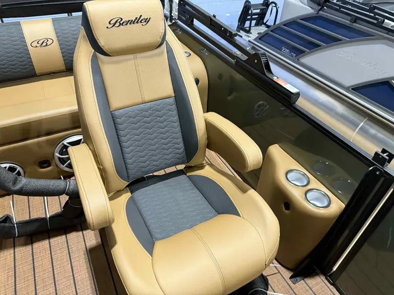 Slide: The Image of Luxurious seating on 2026 Bentley Pontoons Elite 223 Swingback, featuring dual captain chairs. - 11