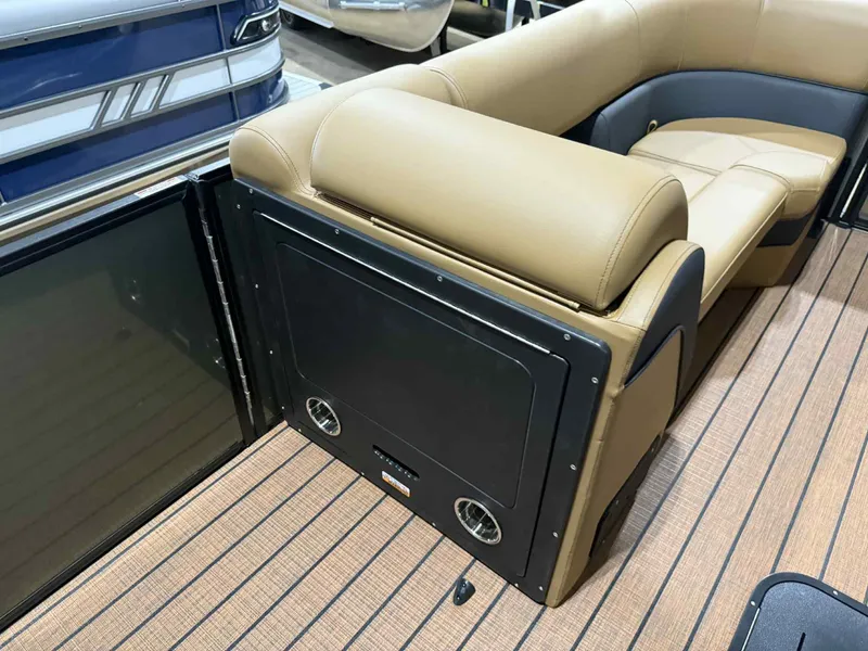 Slide: The Image of 2026 Bentley Pontoons Elite 223 interior with tan seating and sleek design. - 14