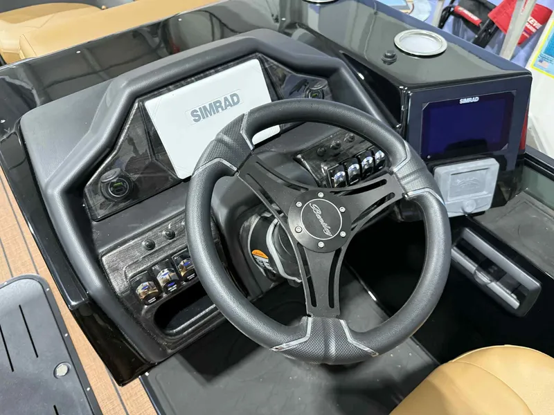 Slide: The Image of 2026 Bentley Pontoons Elite 223 dashboard with steering wheel and Simrad display. - 16