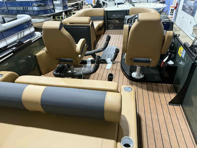 Slide: The Image of 2026 Bentley Pontoons Elite 223 interior with dual captain seats and luxury seating. - 19