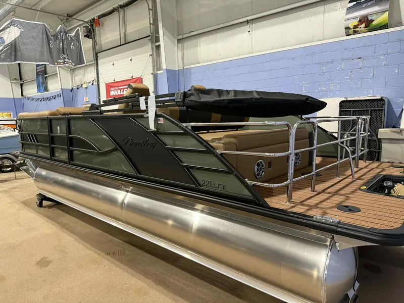 Slide: The Image of 2026 Bentley Pontoons Elite 223 Swingback Dual Captain Full Tube in showroom display. - 4