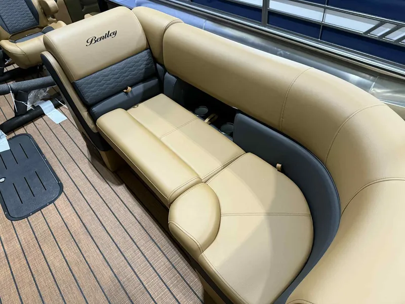 Slide: The Image of Luxurious seating on 2026 Bentley Pontoons Elite 223 Swingback, featuring tan and gray upholstery. - 6