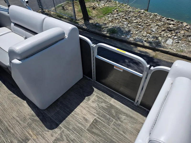 Slide: The Image of Interior of 2021 Godfrey SWEETWATER 2286 SFL pontoon boat with gray seating and flooring. - 12