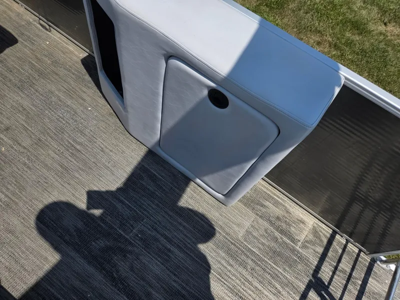 Slide: The Image of 2021 Godfrey SWEETWATER 2286 SFL boat interior with seating and shadow on deck. - 19