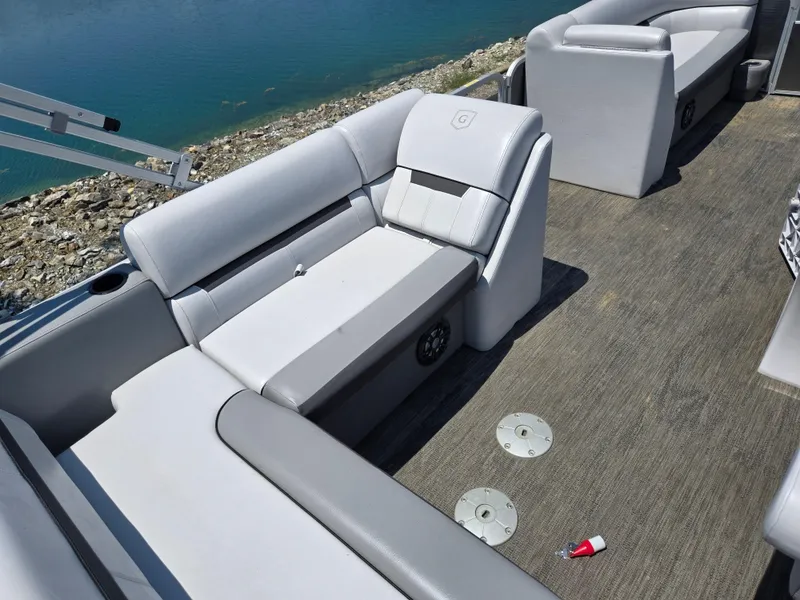 Slide: The Image of 2021 Godfrey SWEETWATER 2286 SFL pontoon boat interior with gray seating and lake view. - 20