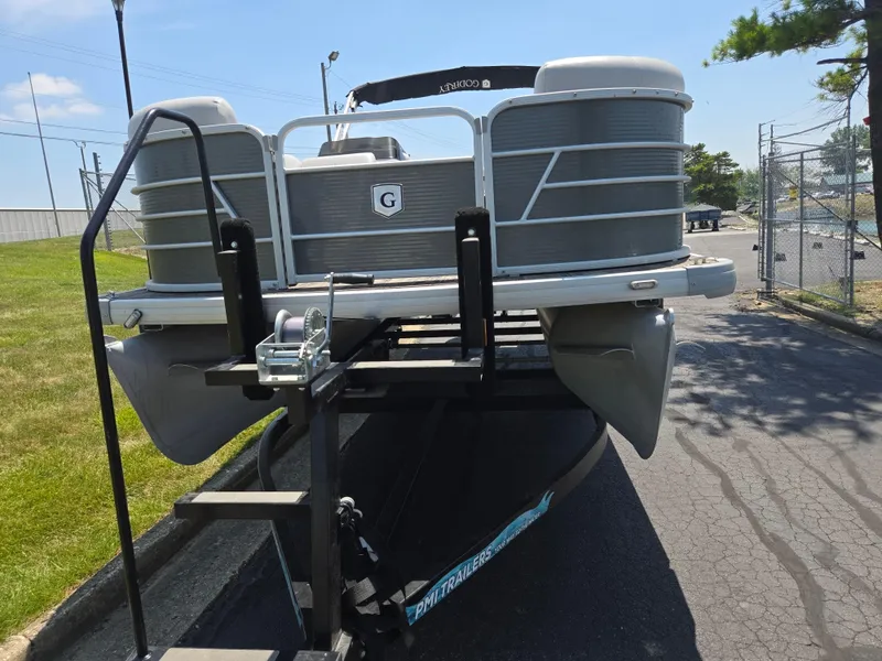 Slide: The Image of 2021 Godfrey SWEETWATER 2286 SFL pontoon boat on trailer, parked outdoors. - 6