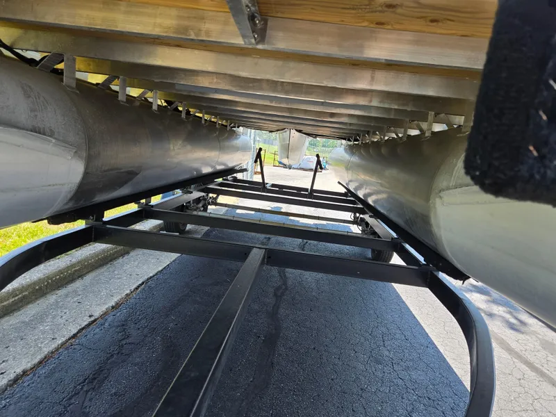 Slide: The Image of Underneath view of 2021 Godfrey SWEETWATER 2286 SFL pontoon boat on a trailer. - 7