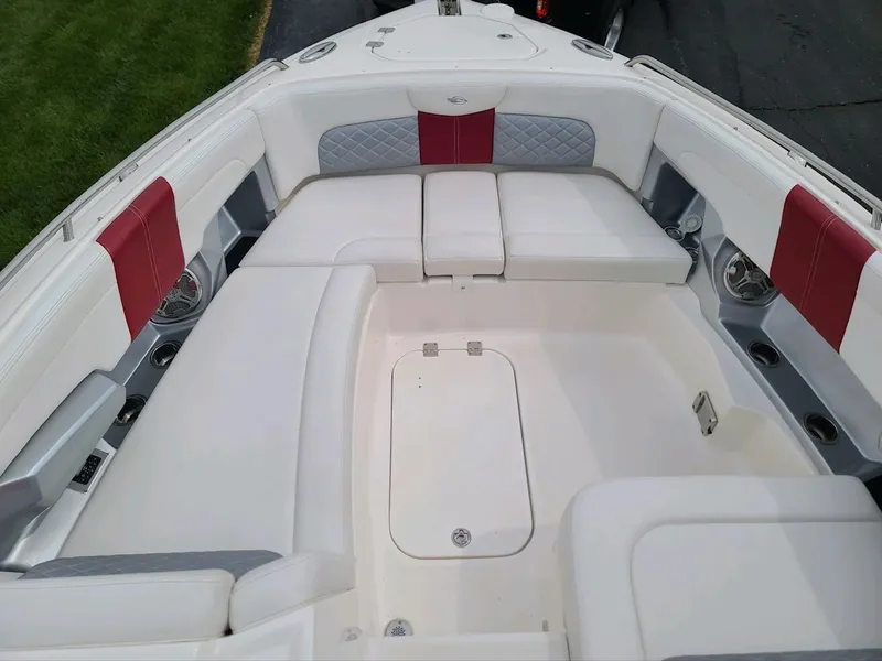 Slide: The Image of 2013 Chaparral 327 SSX boat interior with white and red seating. - 13