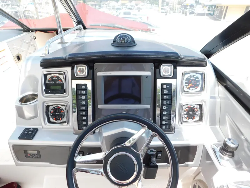 Slide: The Image of 2013 Chaparral 327 SSX dashboard with steering wheel and navigation controls. - 18