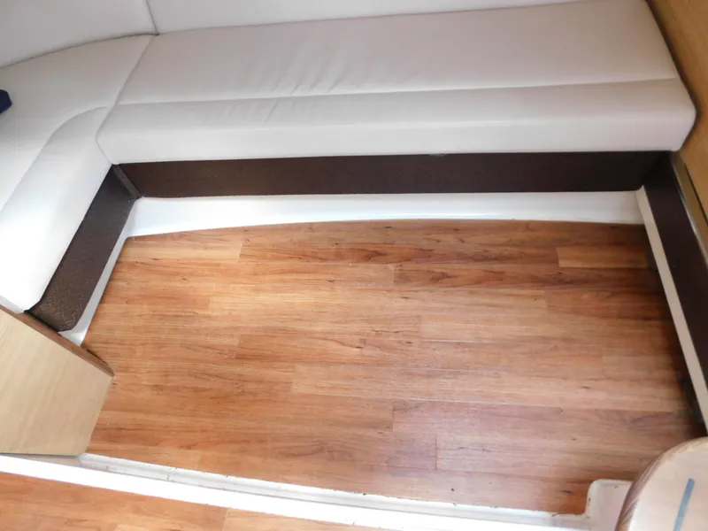 Slide: The Image of Interior of 2013 Chaparral 327 SSX with wood flooring and white seating. - 37