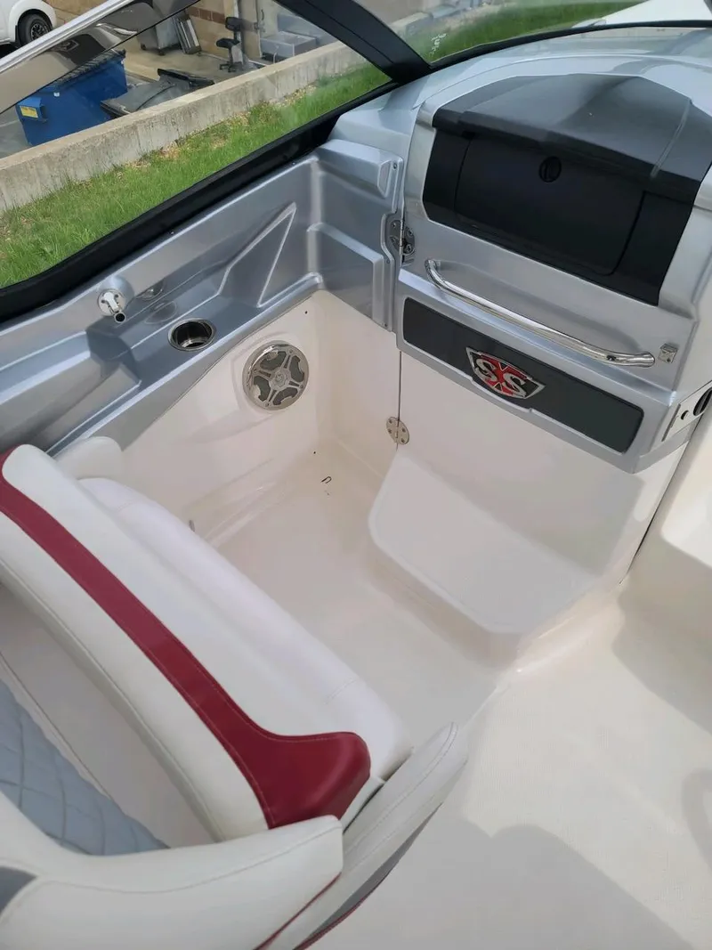 Slide: The Image of Interior of 2013 Chaparral 327 SSX boat with seating and storage compartments. - 44
