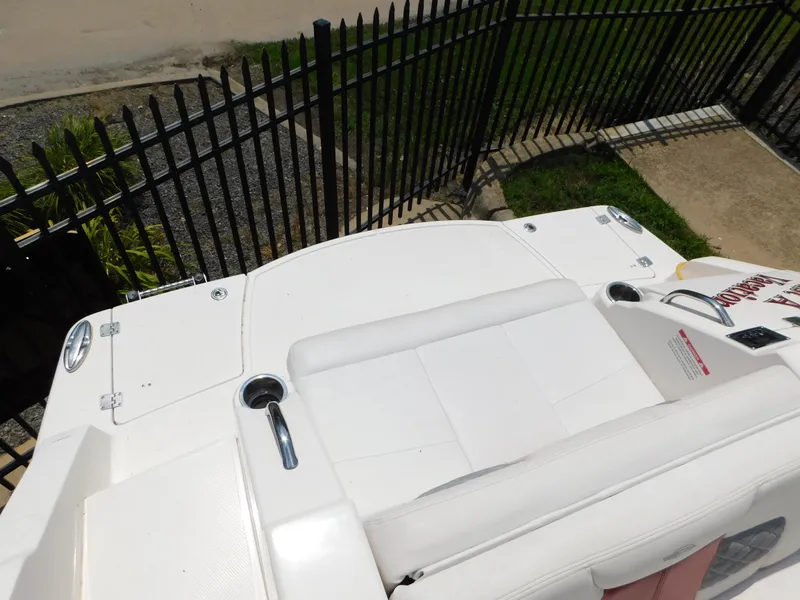 Slide: The Image of 2013 Chaparral 327 SSX boat deck with seating and cup holders. - 49