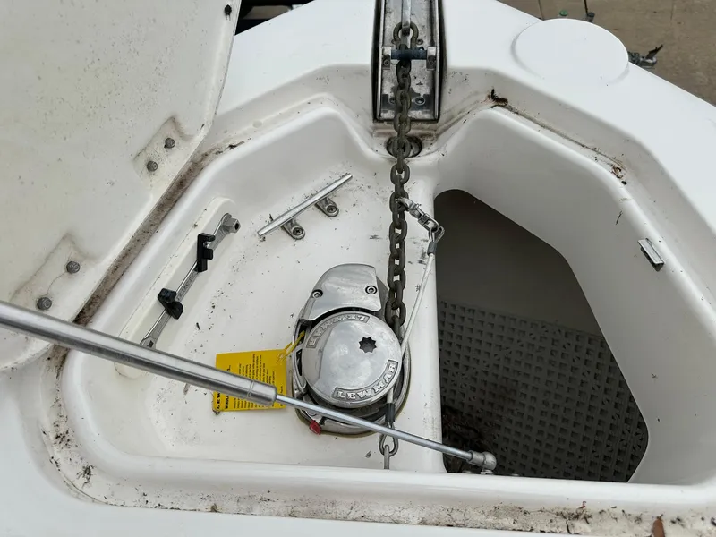 Slide: The Image of Anchor compartment of 2013 Chaparral 327 SSX boat with chain and winch. - 5