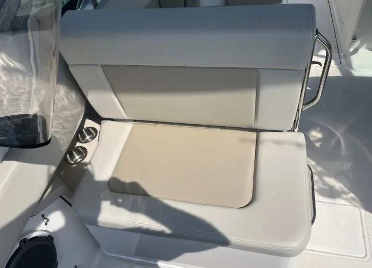 Slide: The Image of 2023 Boston Whaler 240 Vantage boat seat with cup holders and sleek design. - 17