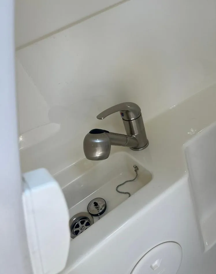 Slide: The Image of Stainless steel faucet in 2023 Boston Whaler 240 Vantage boat sink. - 20