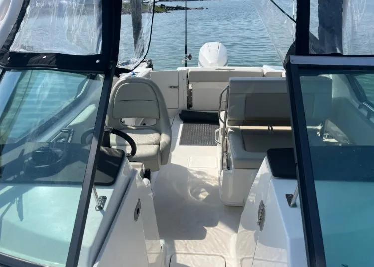 Slide: The Image of 2023 Boston Whaler 240 Vantage interior view with seating and steering wheel. - 7