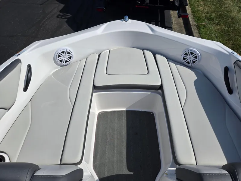 Slide: The Image of 2021 Yamaha Boats SX190 interior with cushioned seating and speakers. - 17