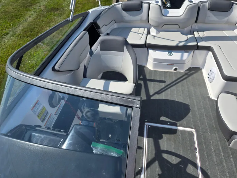 Slide: The Image of 2021 Yamaha Boats SX190 interior with seating and dashboard, showcasing modern design and comfort. - 20