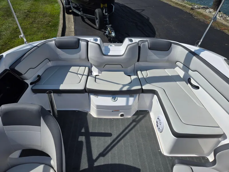 Slide: The Image of 2021 Yamaha Boats SX190 interior with spacious seating and modern design. - 21