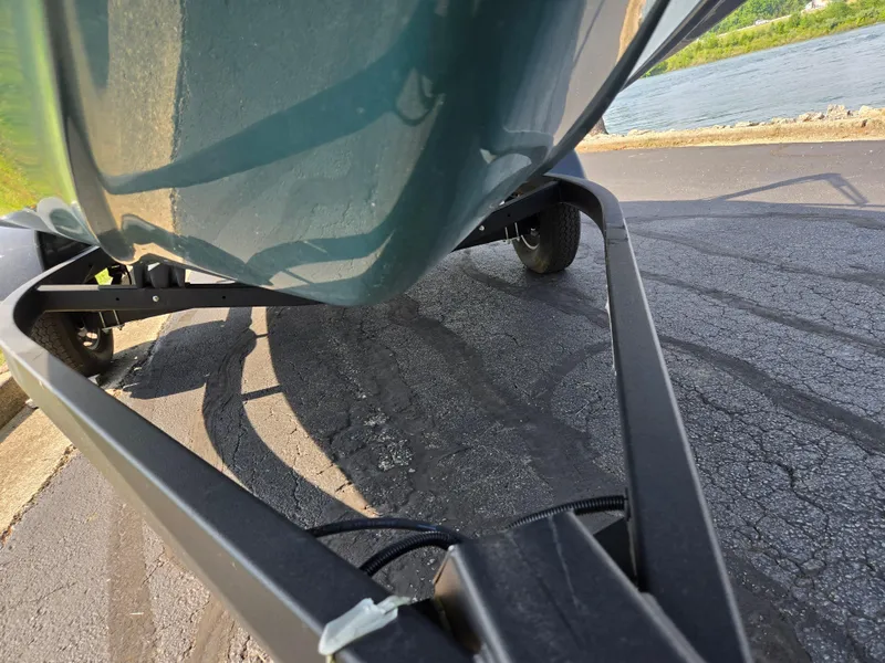 Slide: The Image of 2021 Yamaha SX190 boat on trailer near water, close-up view. - 7