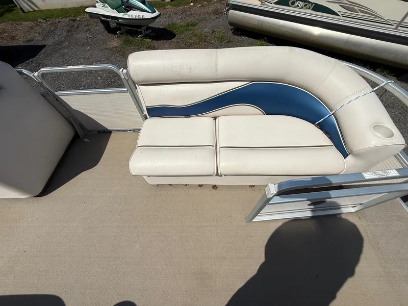 Slide: The Image of 2009 Premier 200 SunSpree boat seat with blue and white upholstery. - 10