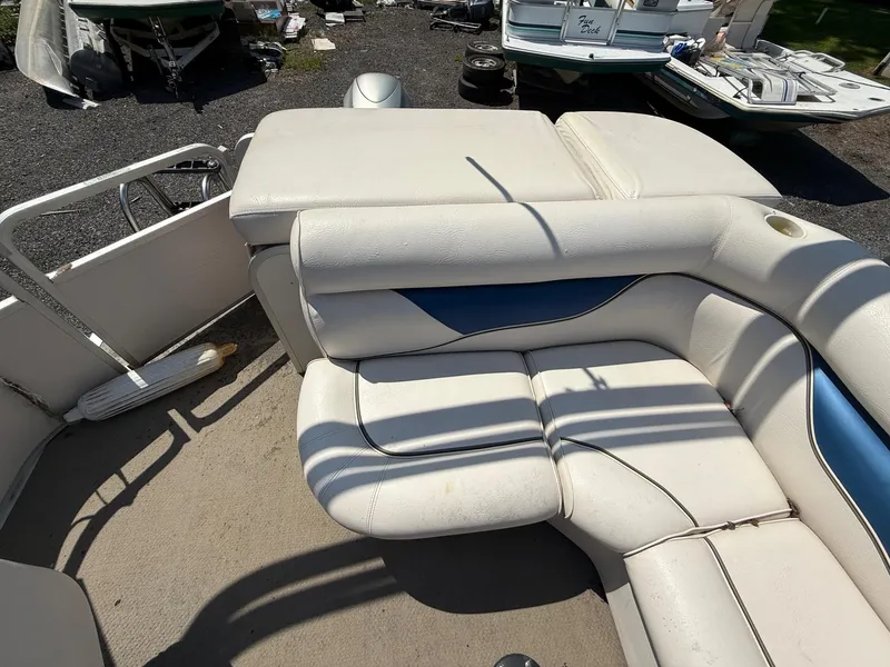 Slide: The Image of 2009 Premier 200 SunSpree boat interior with white and blue seating. - 13
