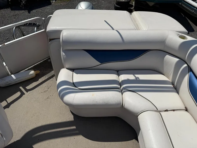 Slide: The Image of 2009 Premier 200 SunSpree boat interior with white and blue cushioned seating. - 14