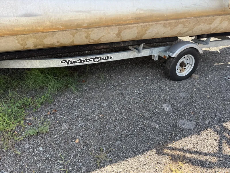 Slide: The Image of Trailer for 2009 Premier 200 SunSpree boat on gravel surface. - 21