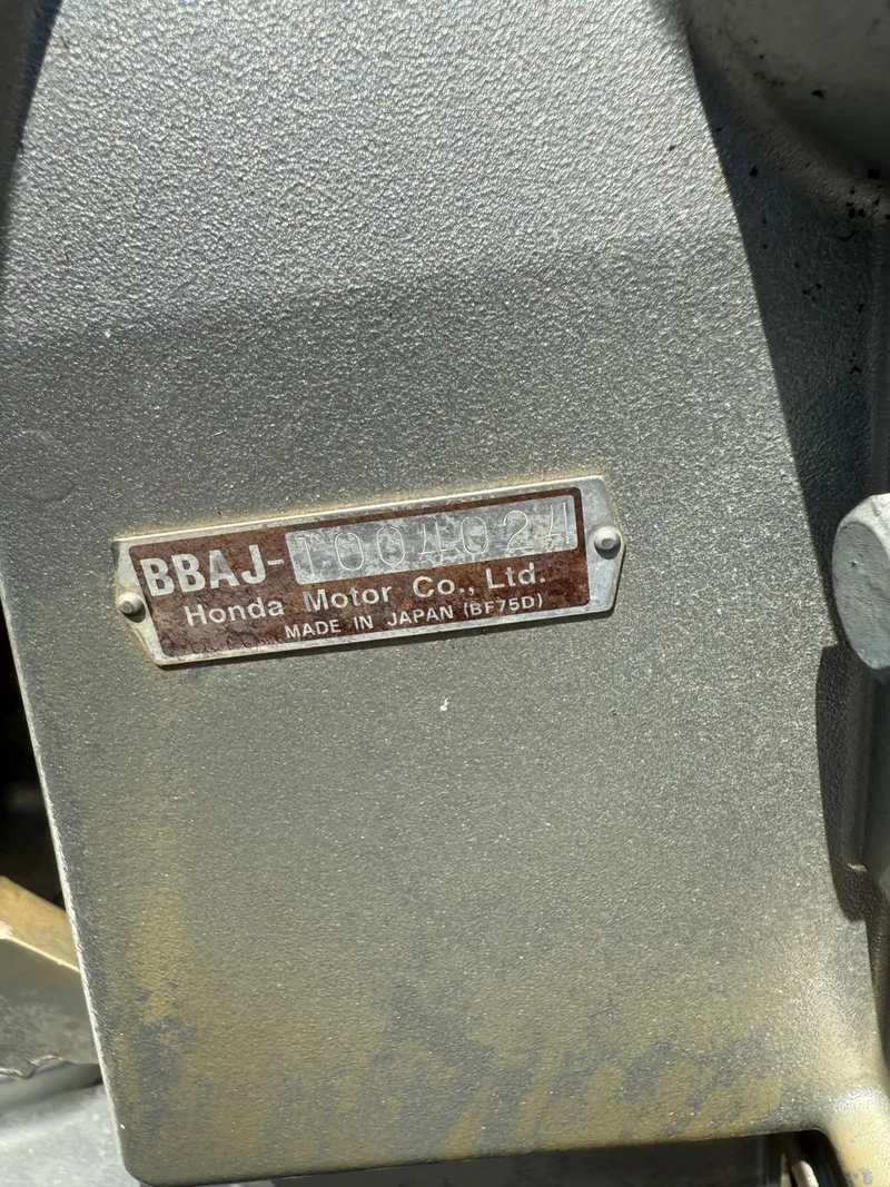 Slide: The Image of Label on Honda engine, model BF75D, made in Japan. - 22