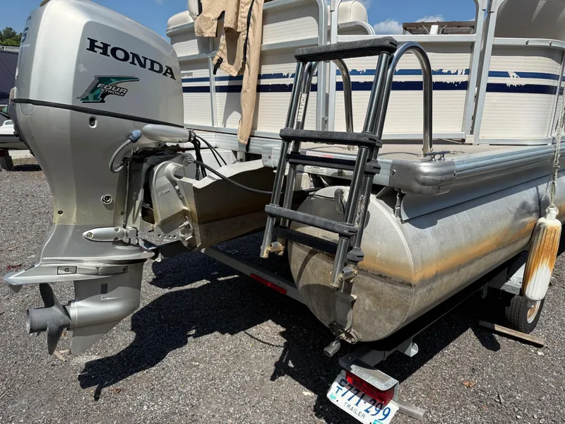 Slide: The Image of 2009 Premier 200 SunSpree pontoon boat with Honda outboard motor and ladder. - 3