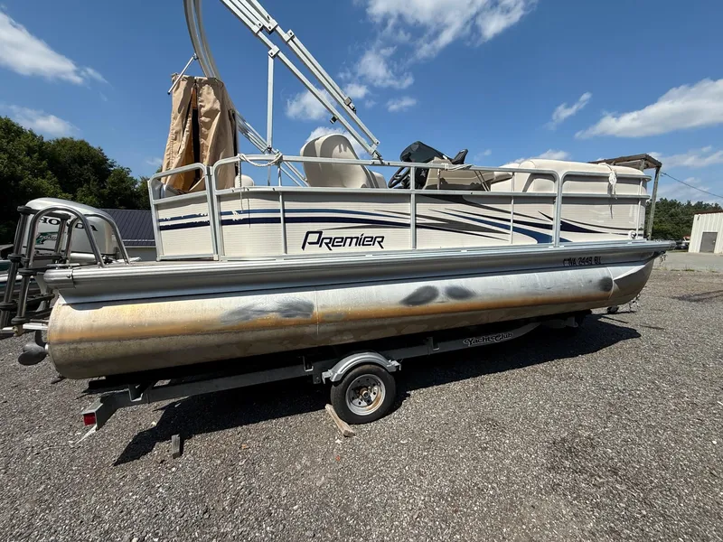 Slide: The Image of 2009 Premier 200 SunSpree pontoon boat on trailer under clear blue sky. - 6
