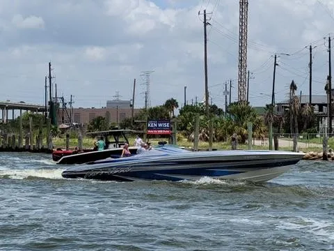 Slide: The Image of 2013 Nor-Tech 477 SPX Vee Bottom speedboat cruising on a sunny day. - 12