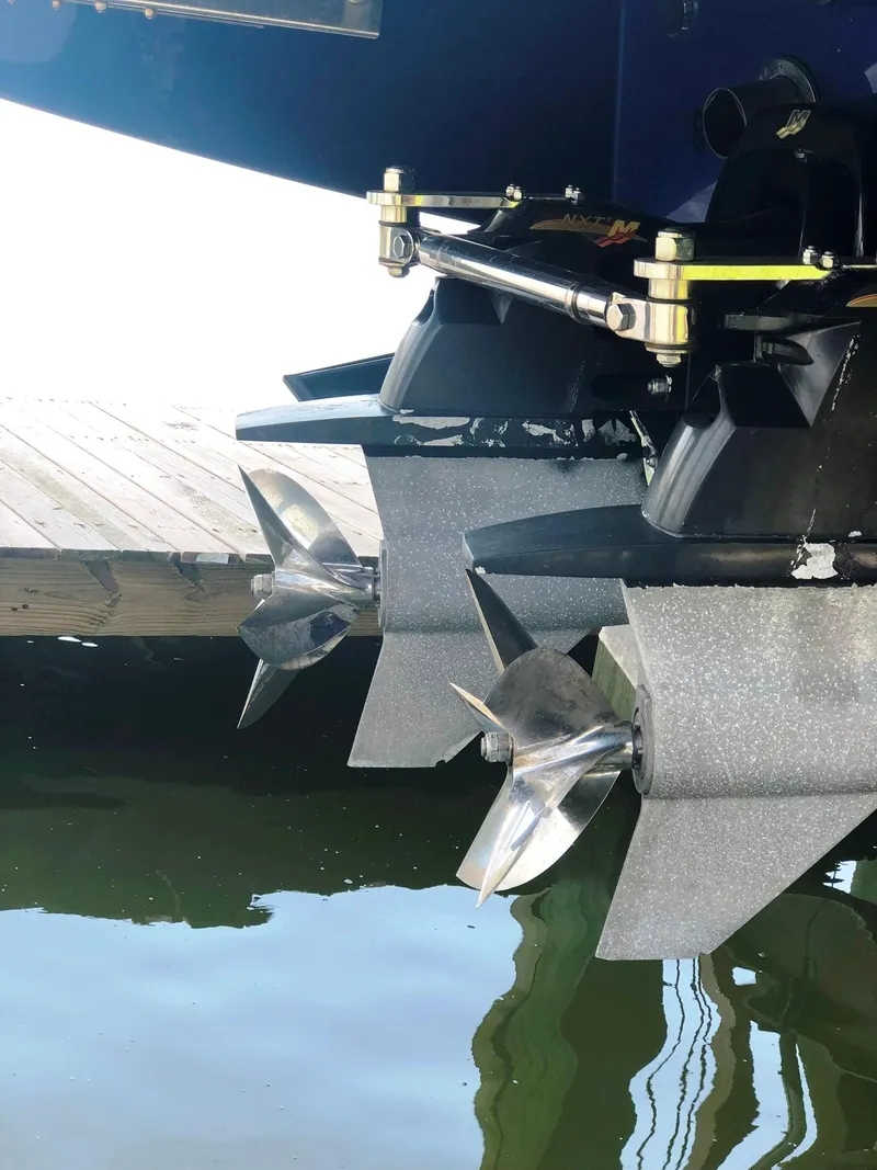 Slide: The Image of 2013 Nor-Tech 477 SPX Vee Bottom boat propellers near dock. - 17