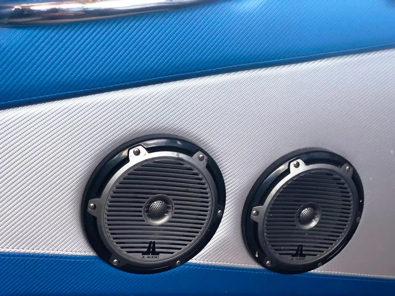 Slide: The Image of Speakers on 2013 Nor-Tech 477 SPX Vee Bottom boat, featuring blue and silver paneling. - 27